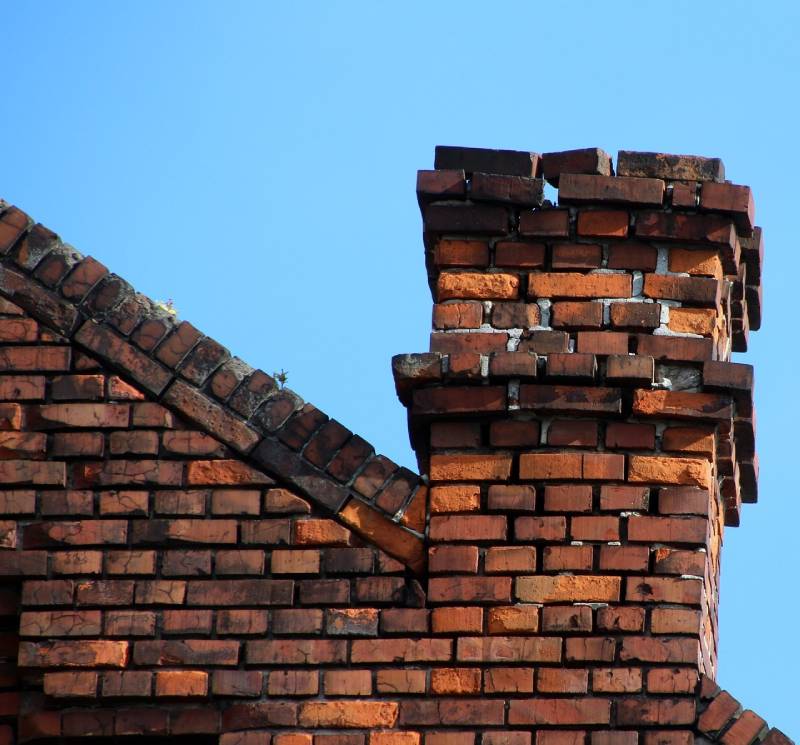 Signs Your Lombard Home Needs a Chimney Inspection Damaged chimney on an Lombard home showing cracks and missing mortar